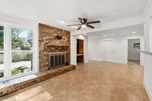 a view of an entryway with wooden floor and windows