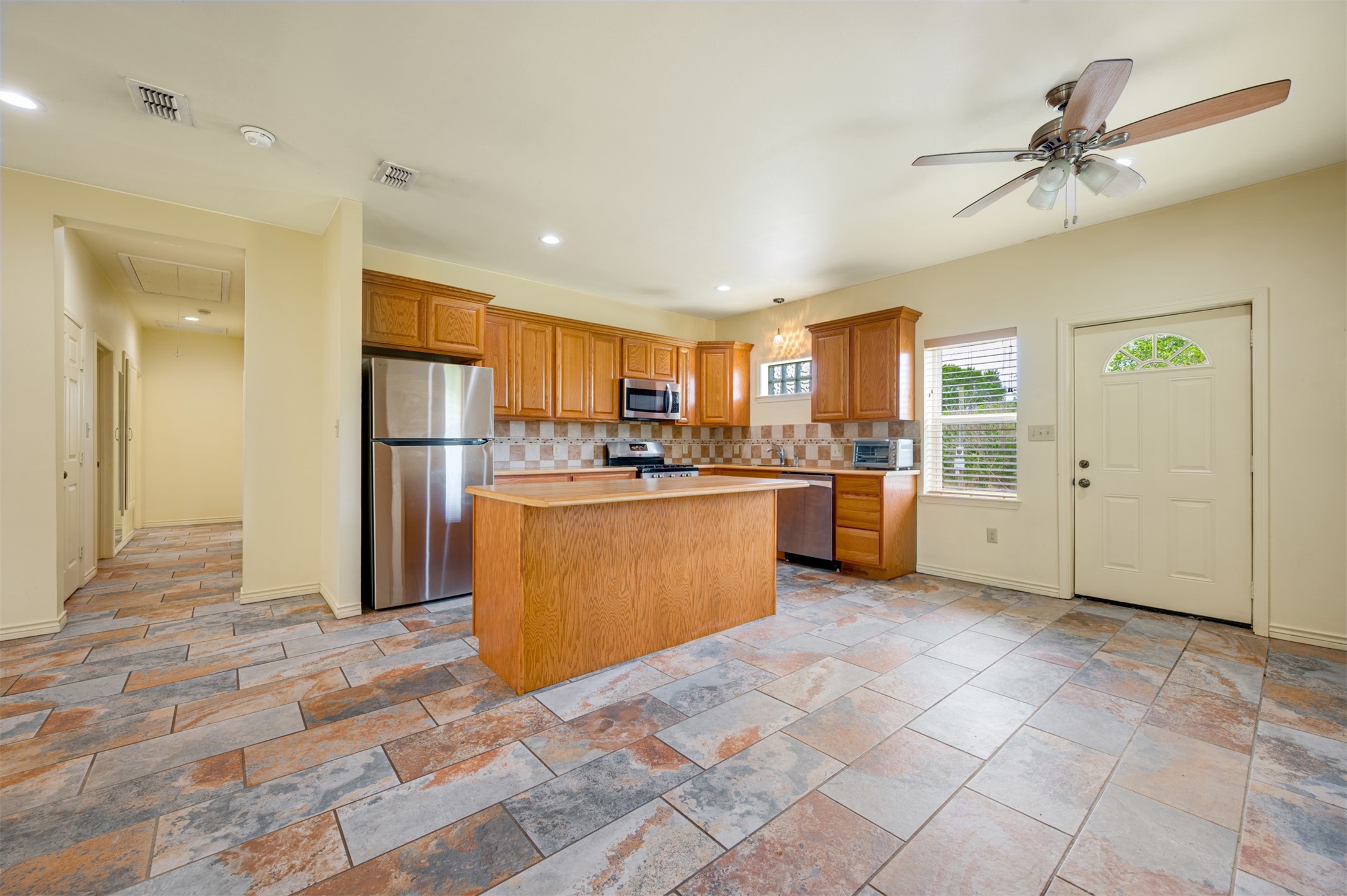 531 County Road 3501 Cuney, TX 75759 - Photo 17 of 45 a kitchen with stainless steel appliances granite countertop a refrigerator and a sink