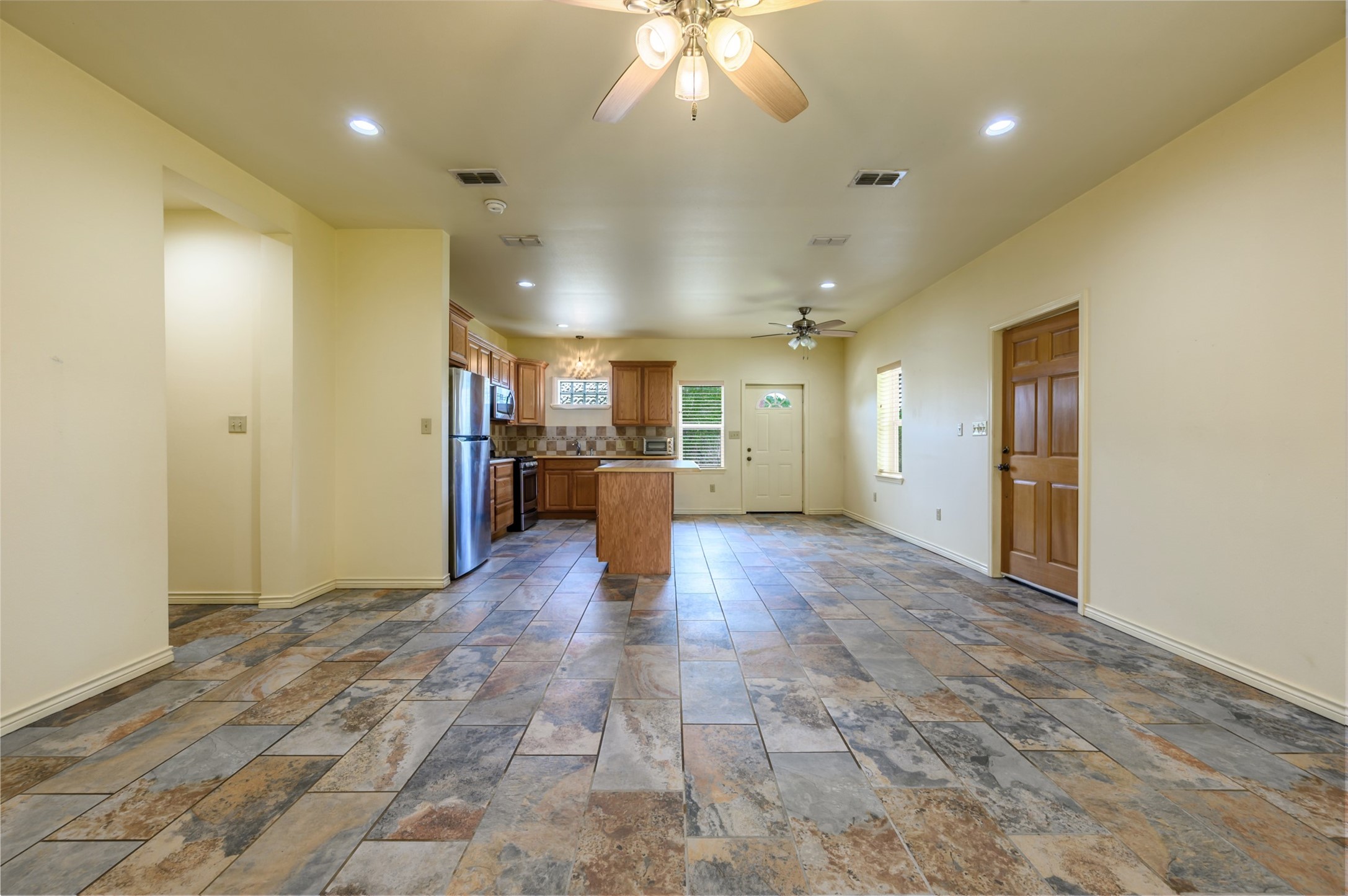 531 County Road 3501 Cuney, TX 75759 - Photo 19 of 45 a view of a hallway with wooden floor and a kitchen