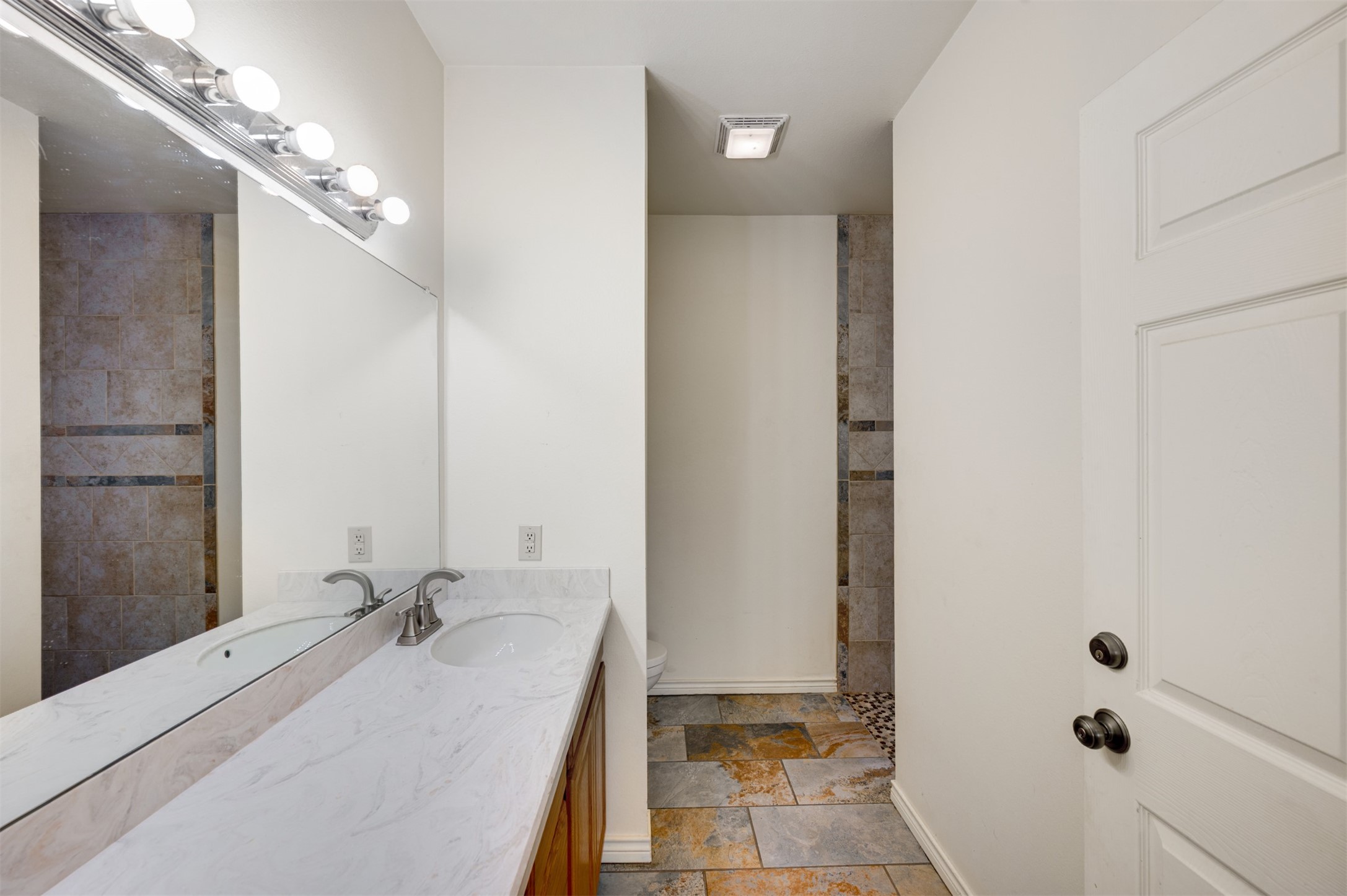 531 County Road 3501 Cuney, TX 75759 - Photo 28 of 45 a bathroom with a tub sink and mirror