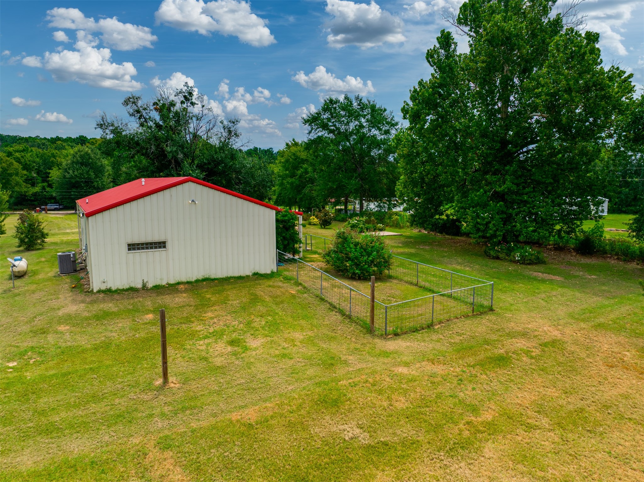 531 County Road 3501 Cuney, TX 75759 - Photo 10 of 45 a house with trees in the background