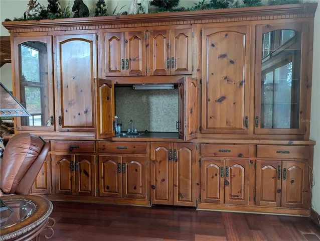 a living room with furniture or couch and a wooden floor