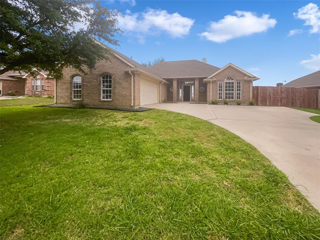 204 Cory Court Krum, TX 76249 - Photo 1 of 1 a front view of a house with a garden