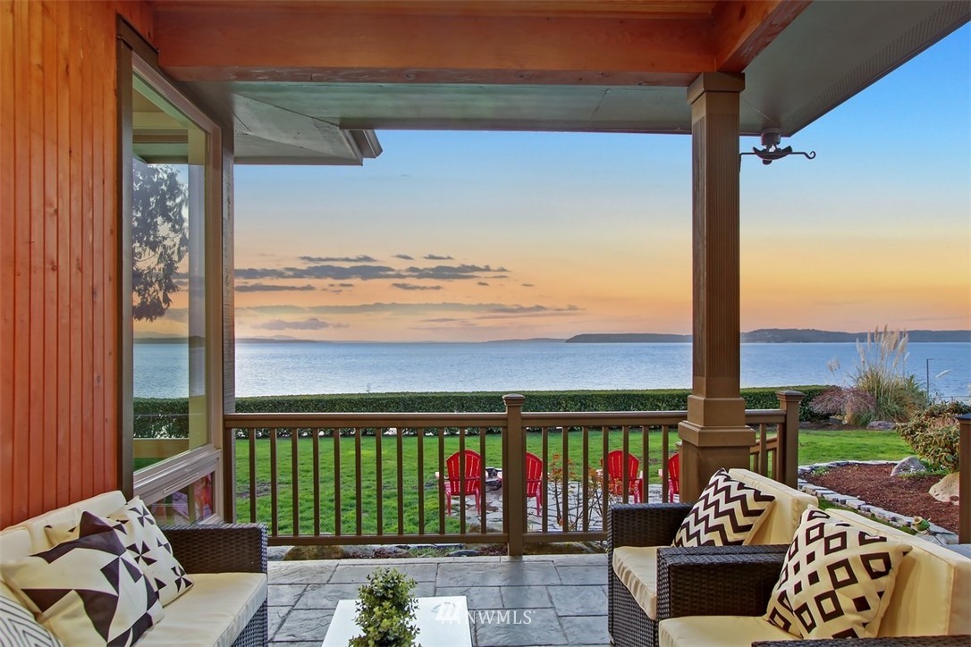 a view of a balcony with wooden floor