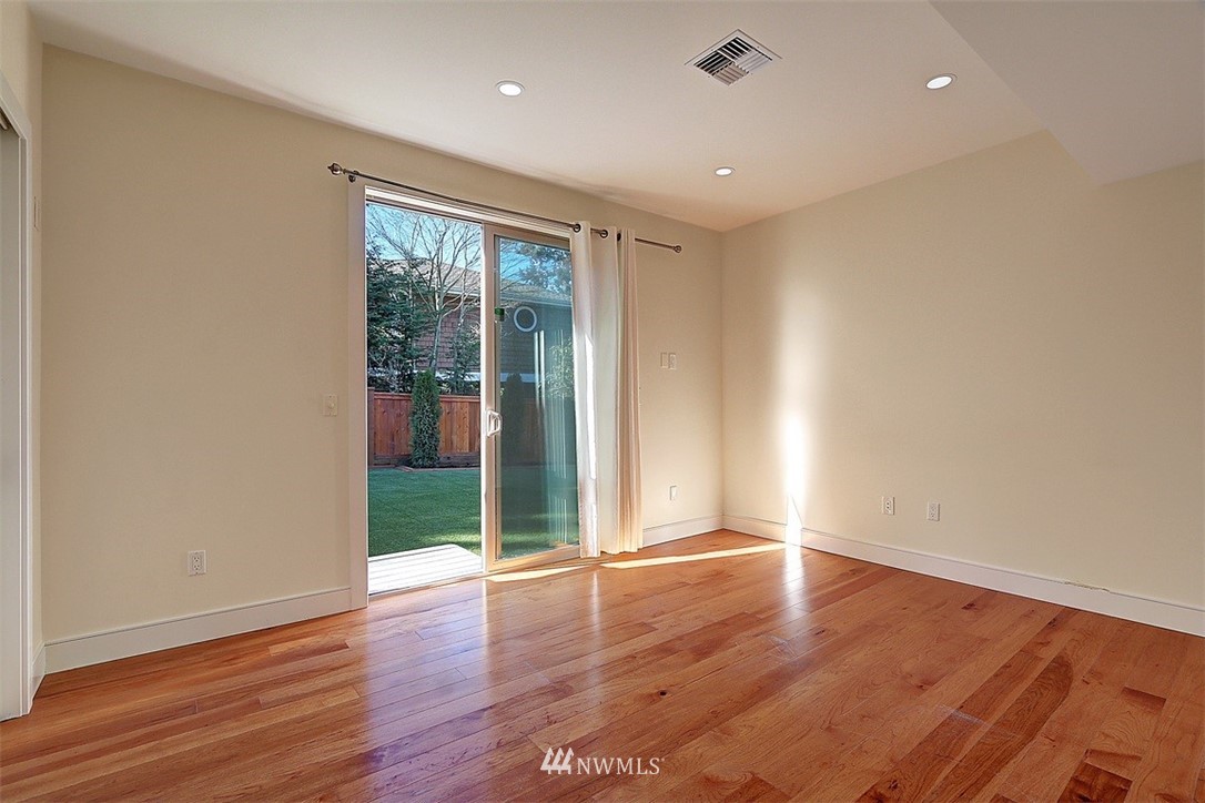 16912 Talbot Road Edmonds, WA 98026 - Photo 23 of 40 a view of an empty room with wooden floor