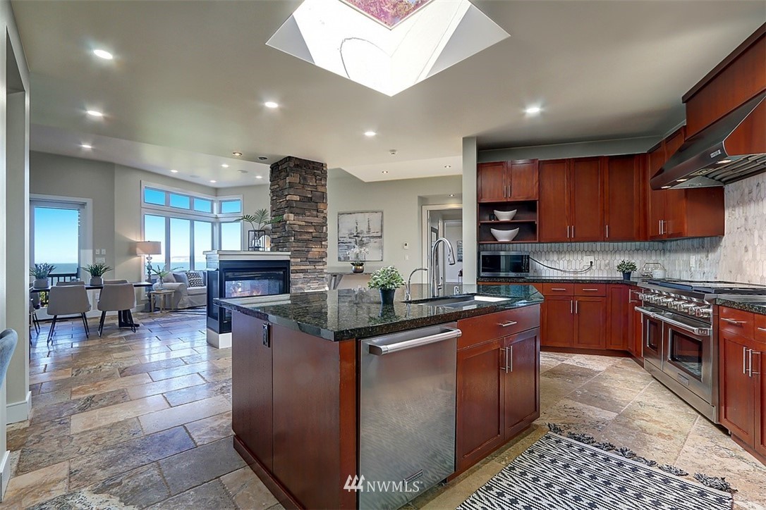 16912 Talbot Road Edmonds, WA 98026 - Photo 6 of 40 a kitchen with stainless steel appliances granite countertop sink stove and cabinets