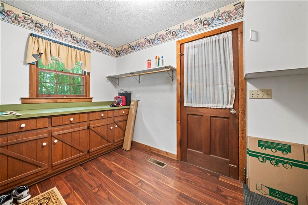 1996 Thomas Road Canton, GA 30115 - Photo 13 of 48 a kitchen with stainless steel appliances granite countertop a refrigerator and a sink