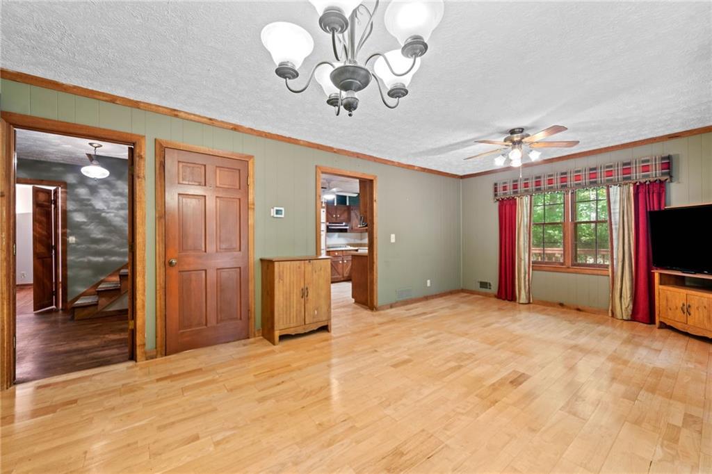 1996 Thomas Road Canton, GA 30115 - Photo 16 of 48 a view of an empty room with a chandelier