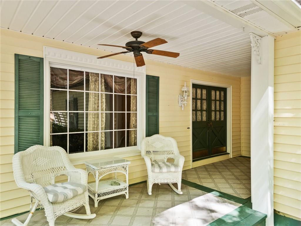 1996 Thomas Road Canton, GA 30115 - Photo 2 of 48 a balcony with table and chairs