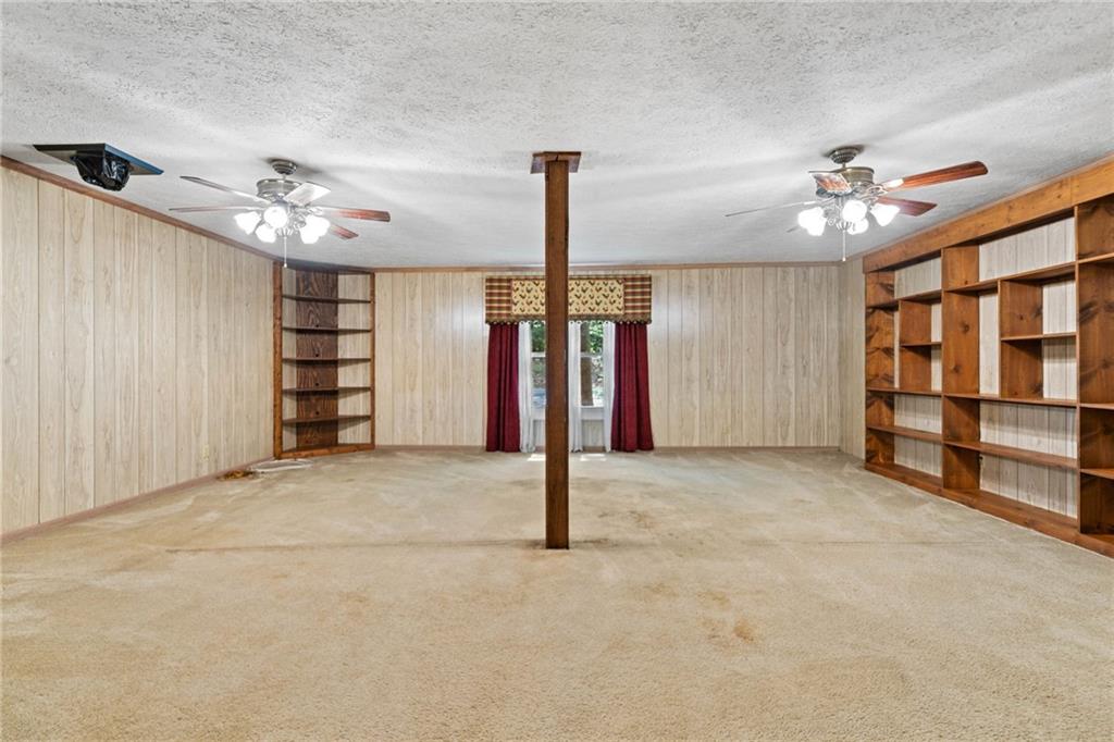 1996 Thomas Road Canton, GA 30115 - Photo 26 of 48 a view of a room with windows and ceiling fan