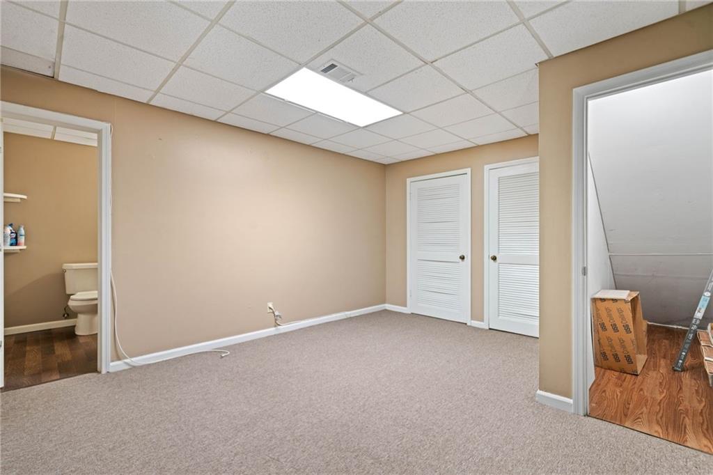 1996 Thomas Road Canton, GA 30115 - Photo 30 of 48 a view of an empty room with a window