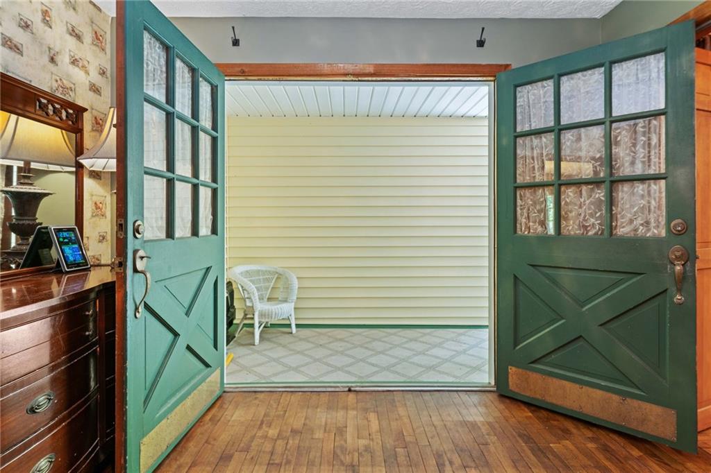 1996 Thomas Road Canton, GA 30115 - Photo 3 of 48 a view of a hallway with wooden floor and stairs