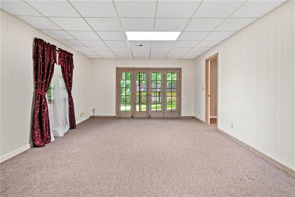 1996 Thomas Road Canton, GA 30115 - Photo 32 of 48 a view of a room with window and ceiling fan