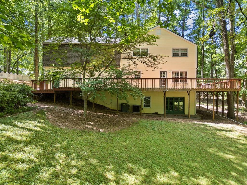 1996 Thomas Road Canton, GA 30115 - Photo 39 of 48 a view of a house with a yard porch and sitting area