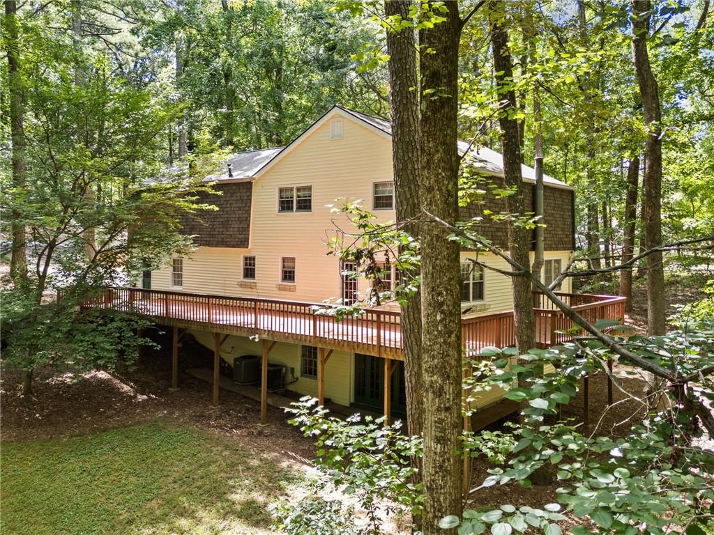 1996 Thomas Road Canton, GA 30115 - Photo 40 of 48 a view of house with backyard and sitting area