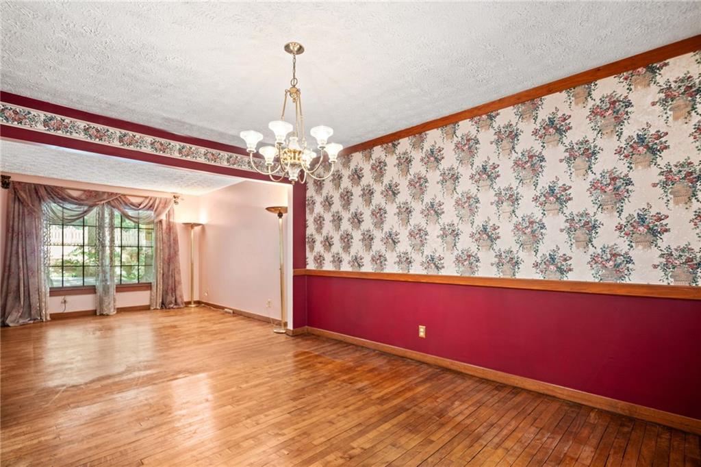 1996 Thomas Road Canton, GA 30115 - Photo 7 of 48 a view of a room with window wooden floor and chandelier