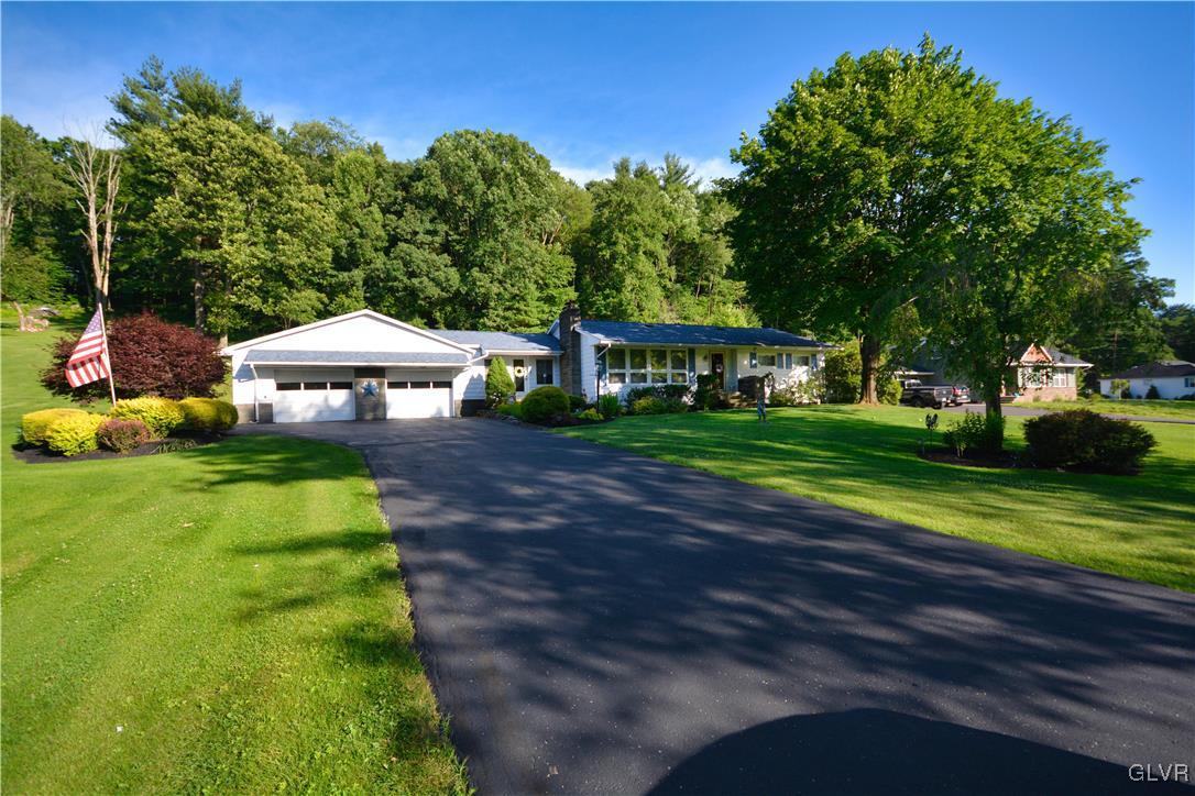 2555 Chase Road Shavertown, PA 18708 - Photo 21 of 21 a front view of a house with a yard table and chairs