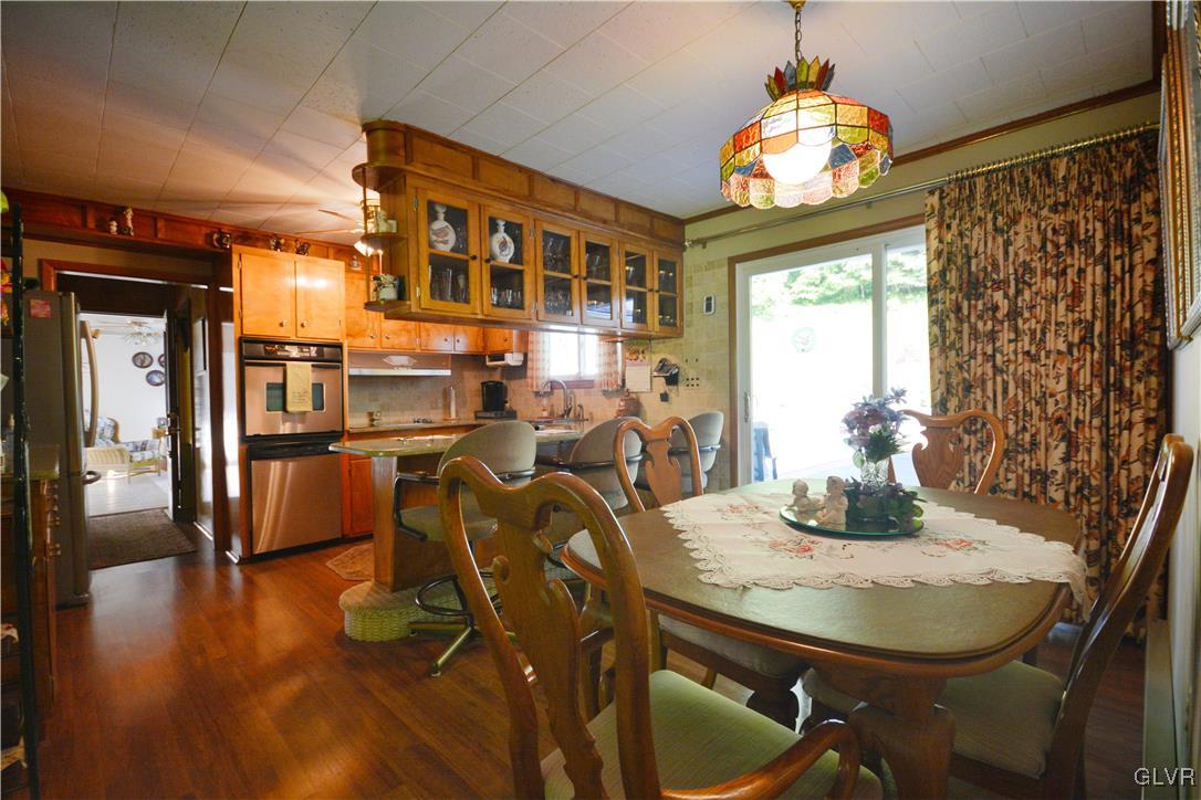 2555 Chase Road Shavertown, PA 18708 - Photo 5 of 21 a dining room with furniture a chandelier and wooden floor