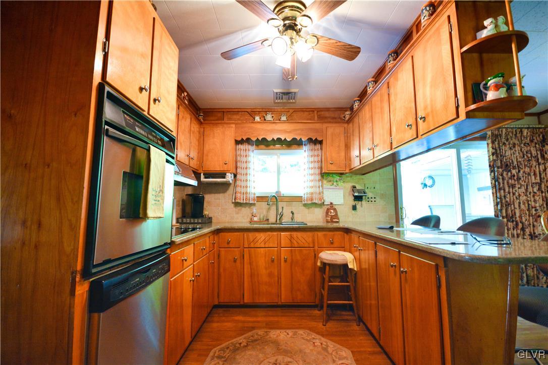 2555 Chase Road Shavertown, PA 18708 - Photo 7 of 21 a kitchen with stainless steel appliances granite countertop a sink and cabinets