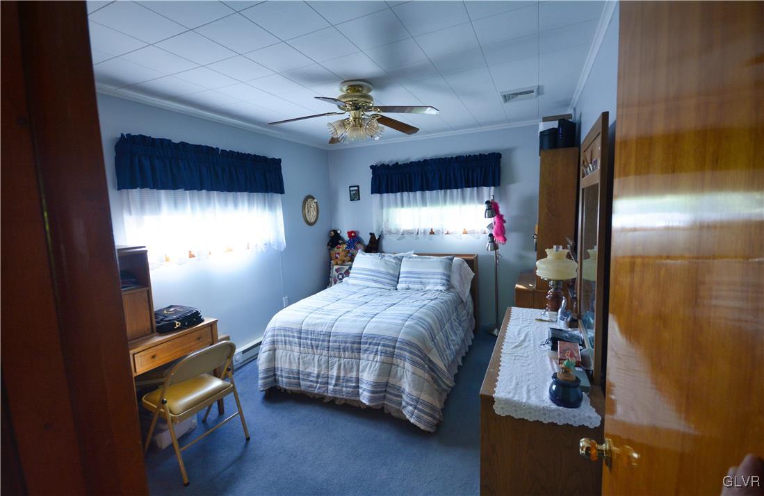 2555 Chase Road Shavertown, PA 18708 - Photo 10 of 21 a bedroom with a bed and a chandelier