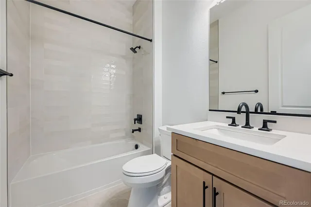 a bathroom with a sink a toilet and a bathtub