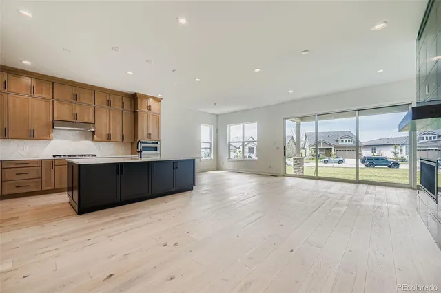 a view of kitchen with a sink and cabinets