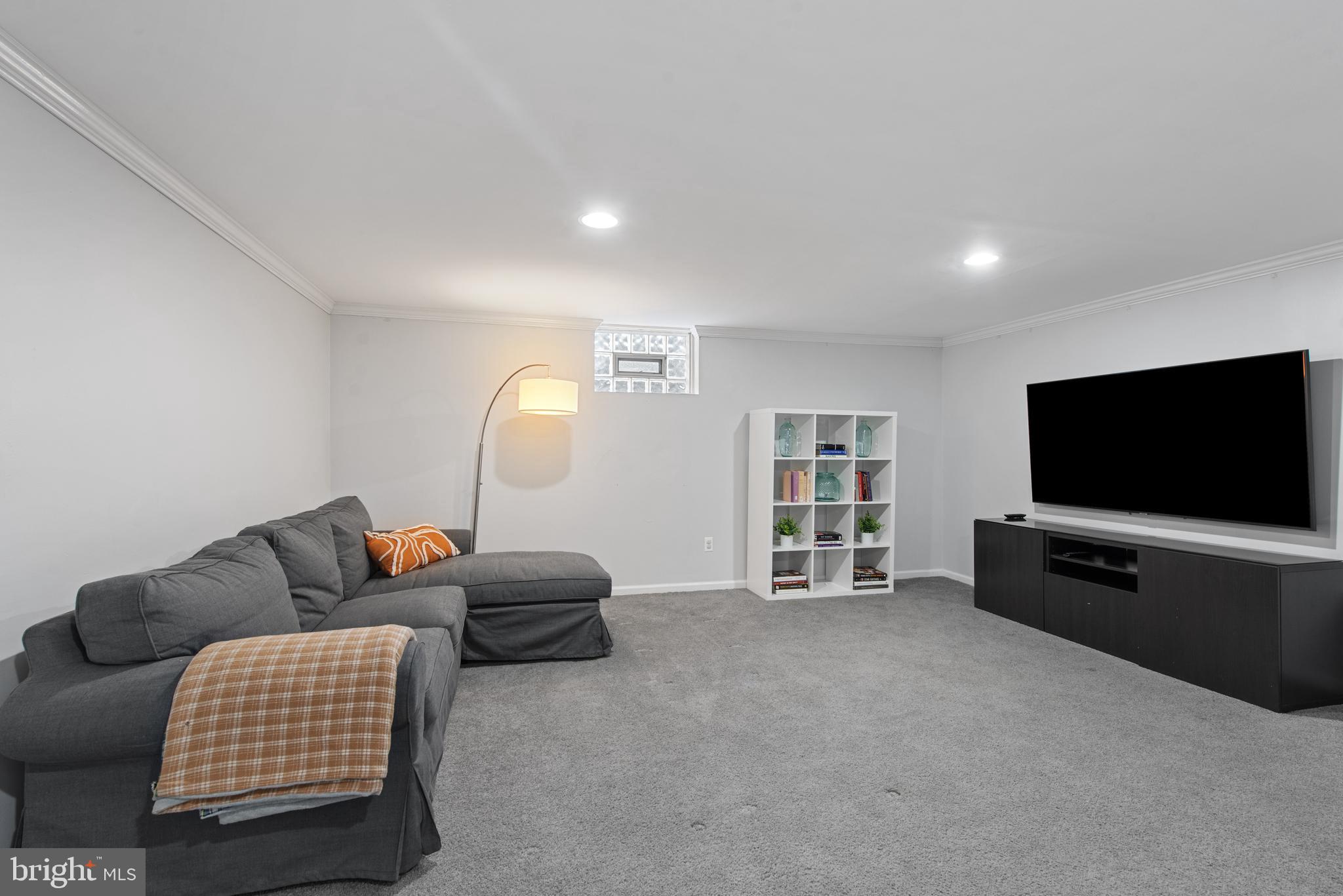 330 Dumbarton Road Baltimore, MD 21212 - Photo 11 of 29 a living room with furniture and a flat screen tv