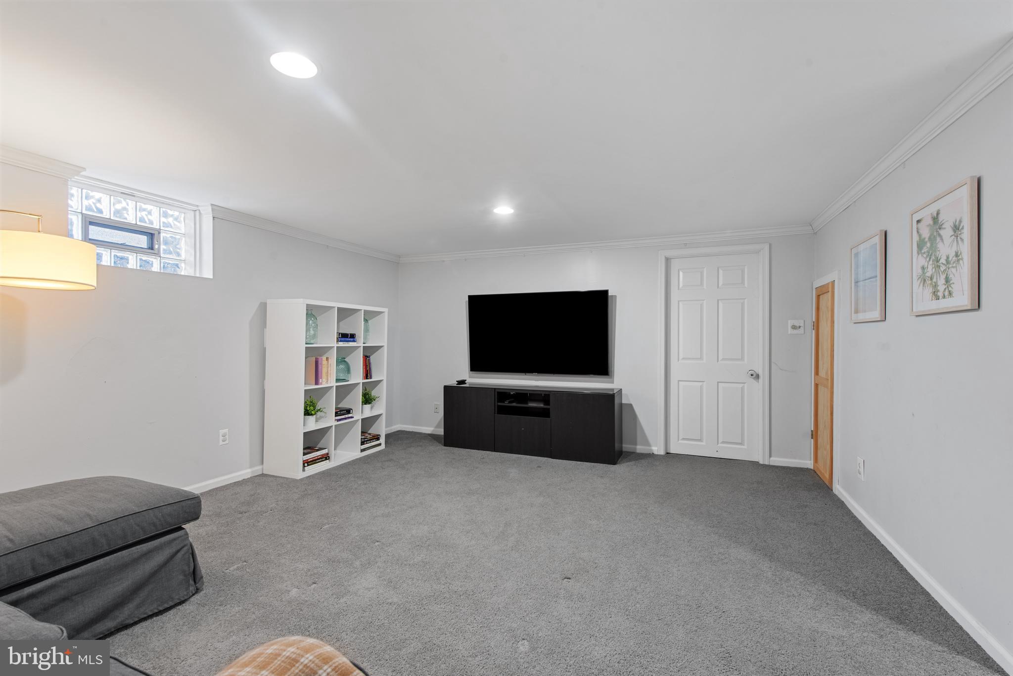 330 Dumbarton Road Baltimore, MD 21212 - Photo 12 of 29 a living room with furniture and a flat screen tv