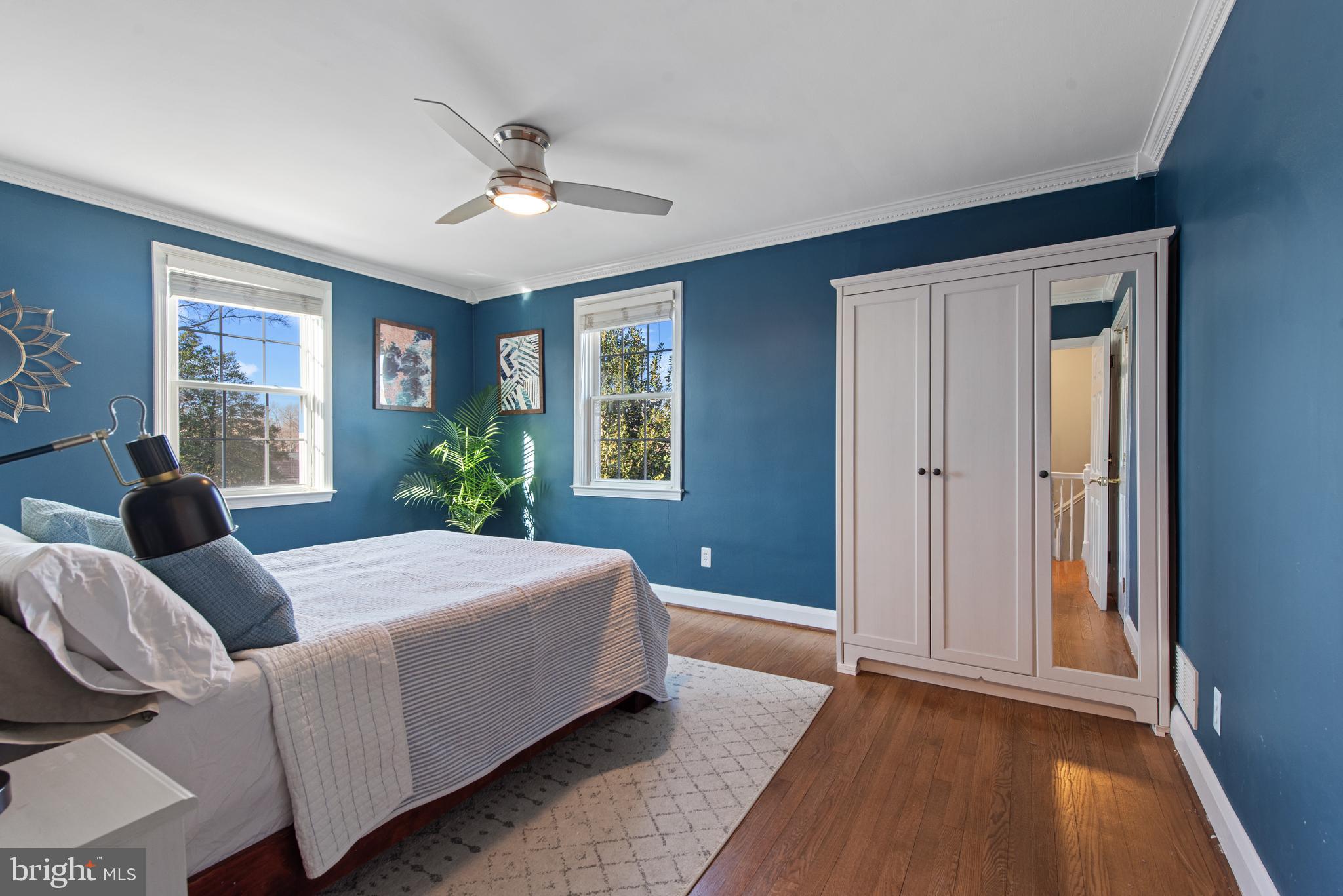 330 Dumbarton Road Baltimore, MD 21212 - Photo 14 of 29 a bedroom with a large bed potted plant and a window