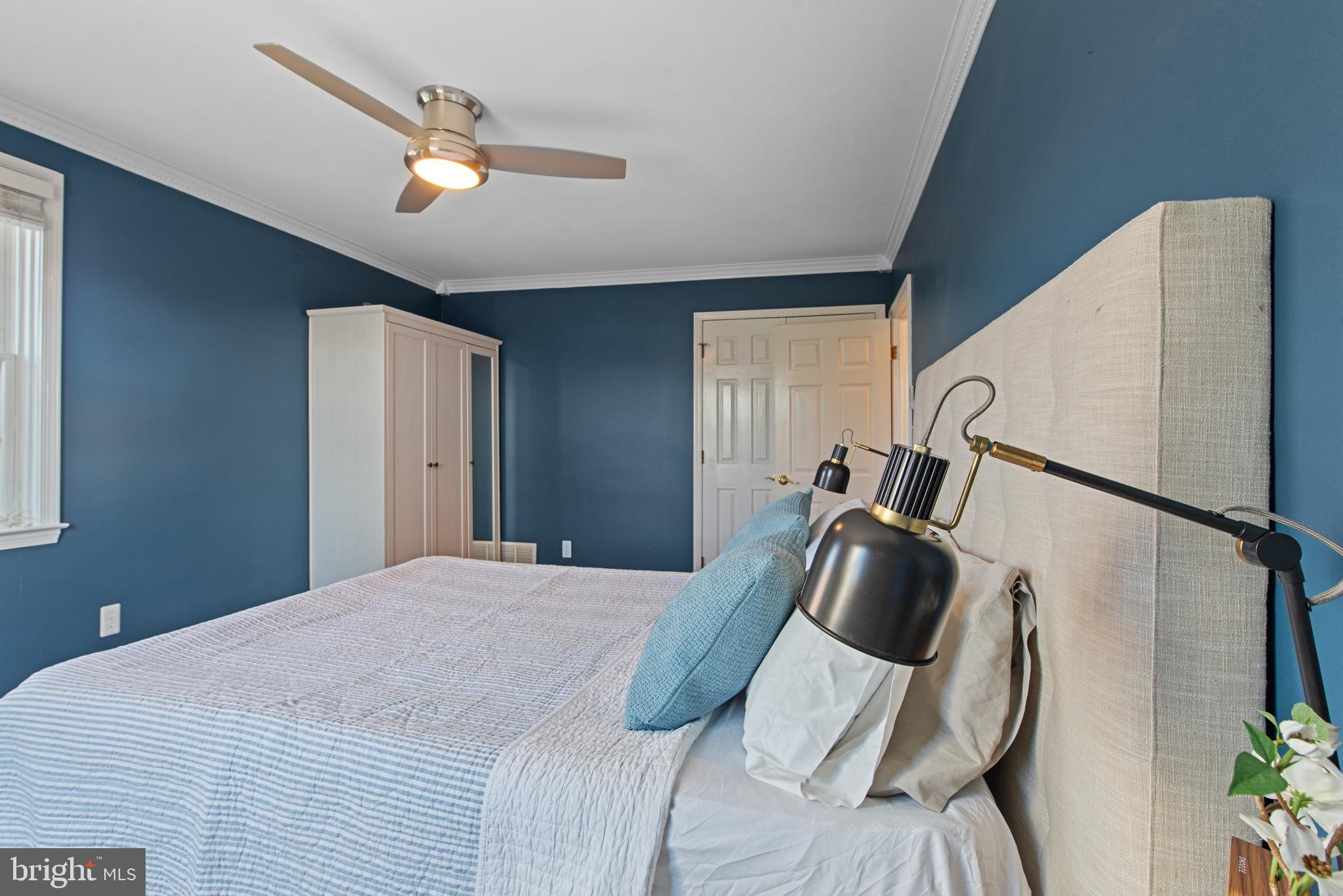 330 Dumbarton Road Baltimore, MD 21212 - Photo 16 of 29 a bedroom with a bed and a large window