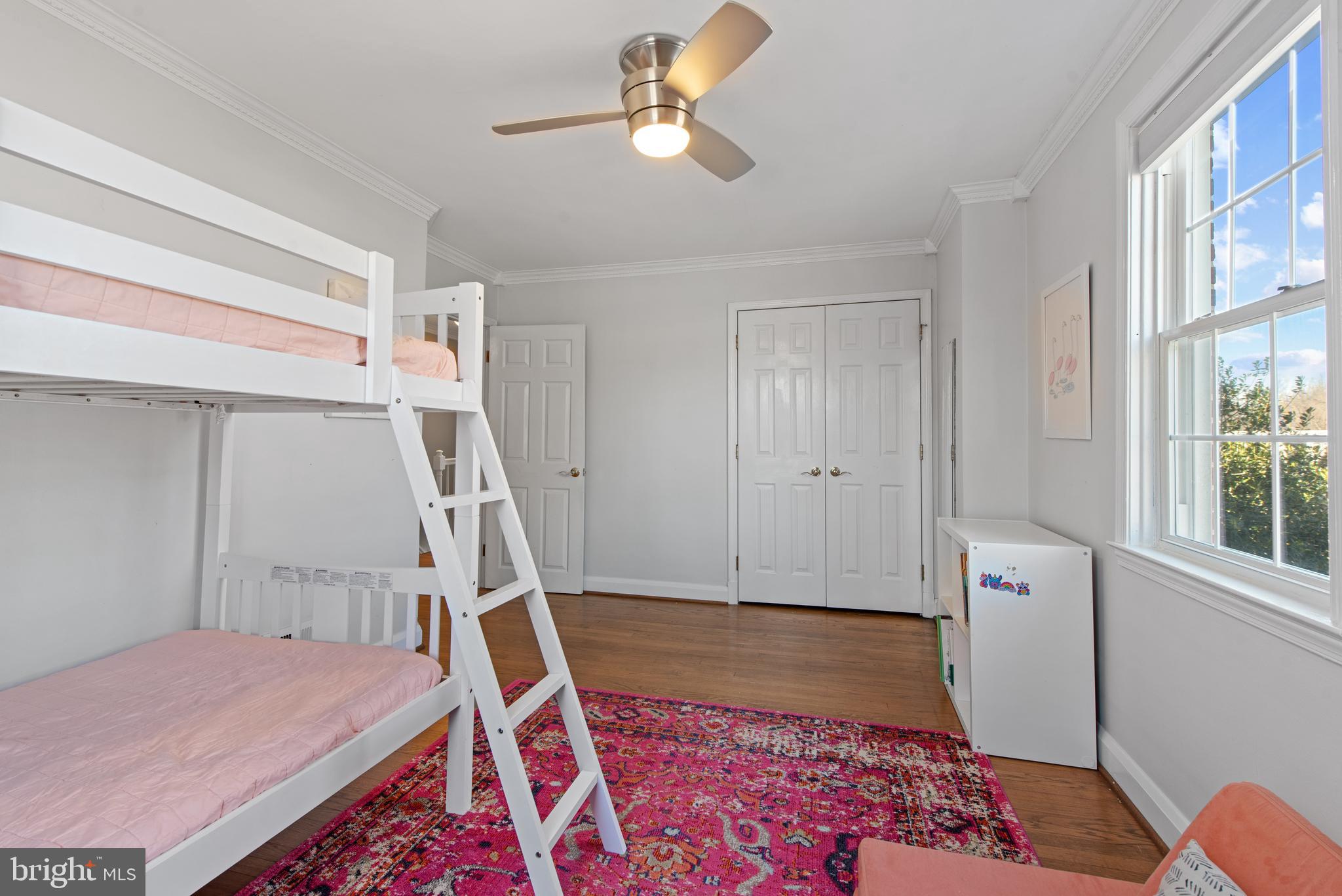 330 Dumbarton Road Baltimore, MD 21212 - Photo 18 of 29 a bedroom with a bed and a chandelier
