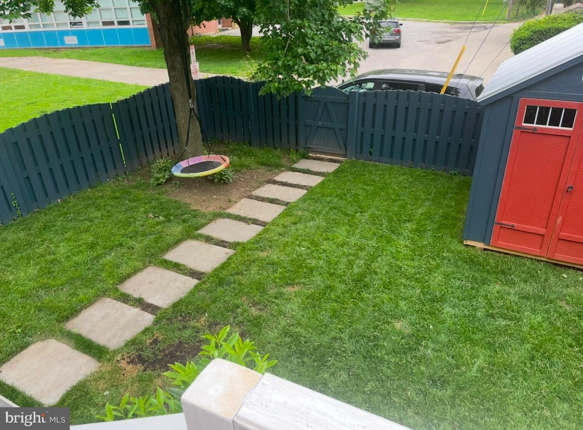 330 Dumbarton Road Baltimore, MD 21212 - Photo 25 of 29 a backyard of a house with yard and outdoor seating