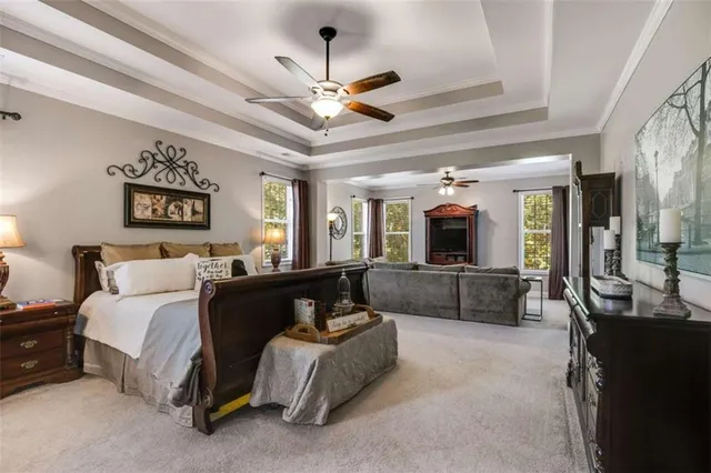 a living room with fireplace furniture and a flat screen tv
