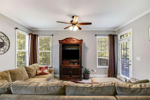 a bedroom with a bed couch and dresser