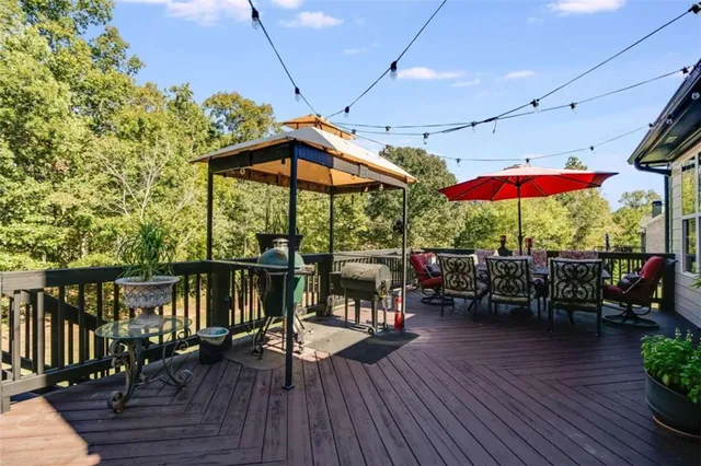 a en suite bathroom with a granite countertop sink and a mirror