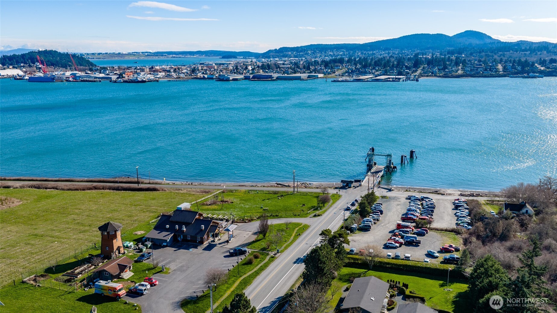 6117 South Shore Road Anacortes, WA 98221 - Photo 5 of 7 an aerial view of a house with a garden and lake view