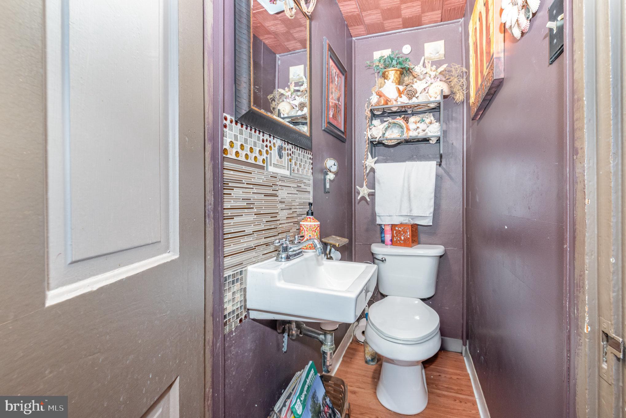 135 Lucknow Road Harrisburg, PA 17110 - Photo 13 of 27 a white toilet sitting next to a bathroom sink