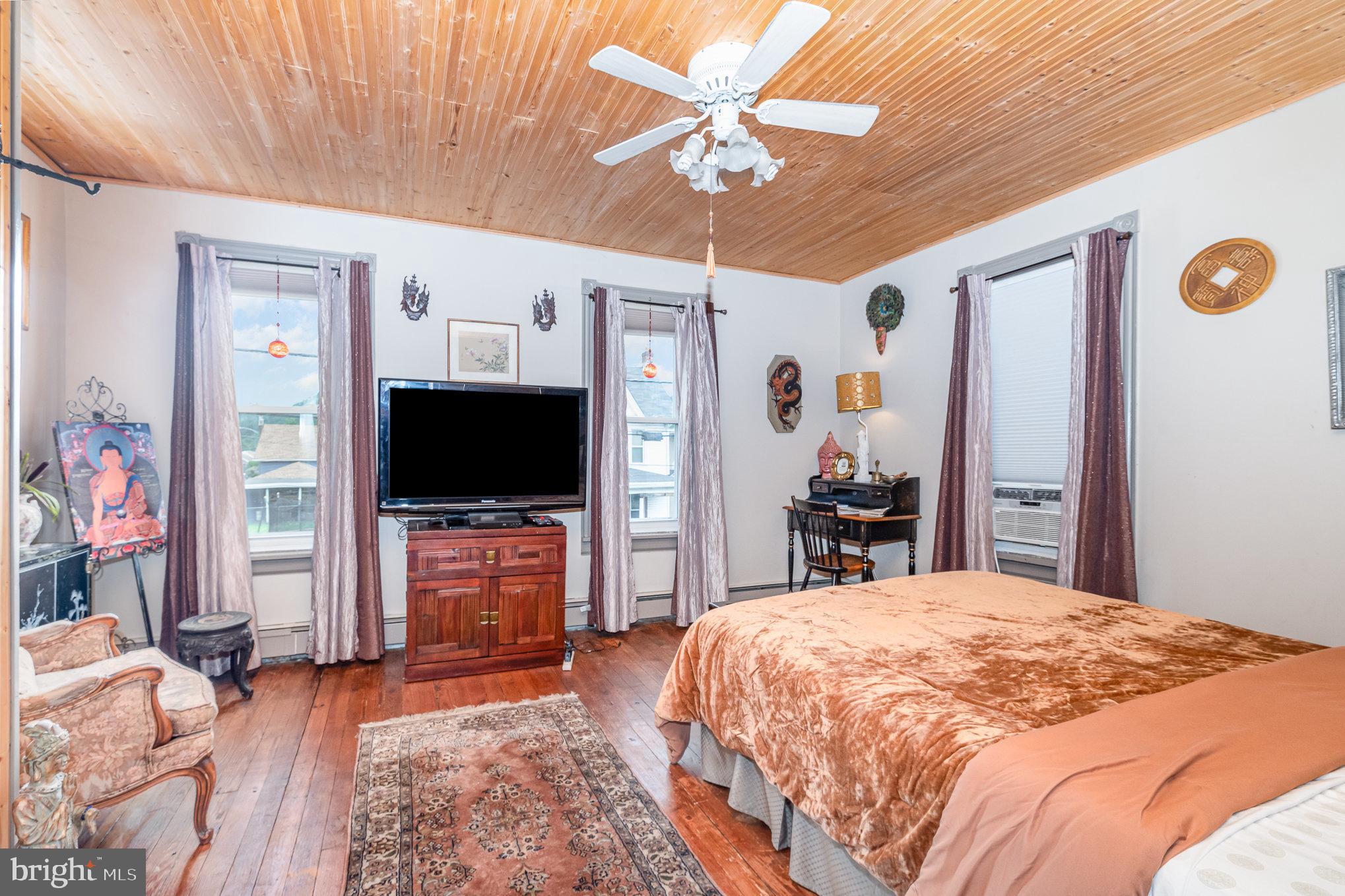 135 Lucknow Road Harrisburg, PA 17110 - Photo 14 of 27 a bedroom with a bed and a flat screen tv