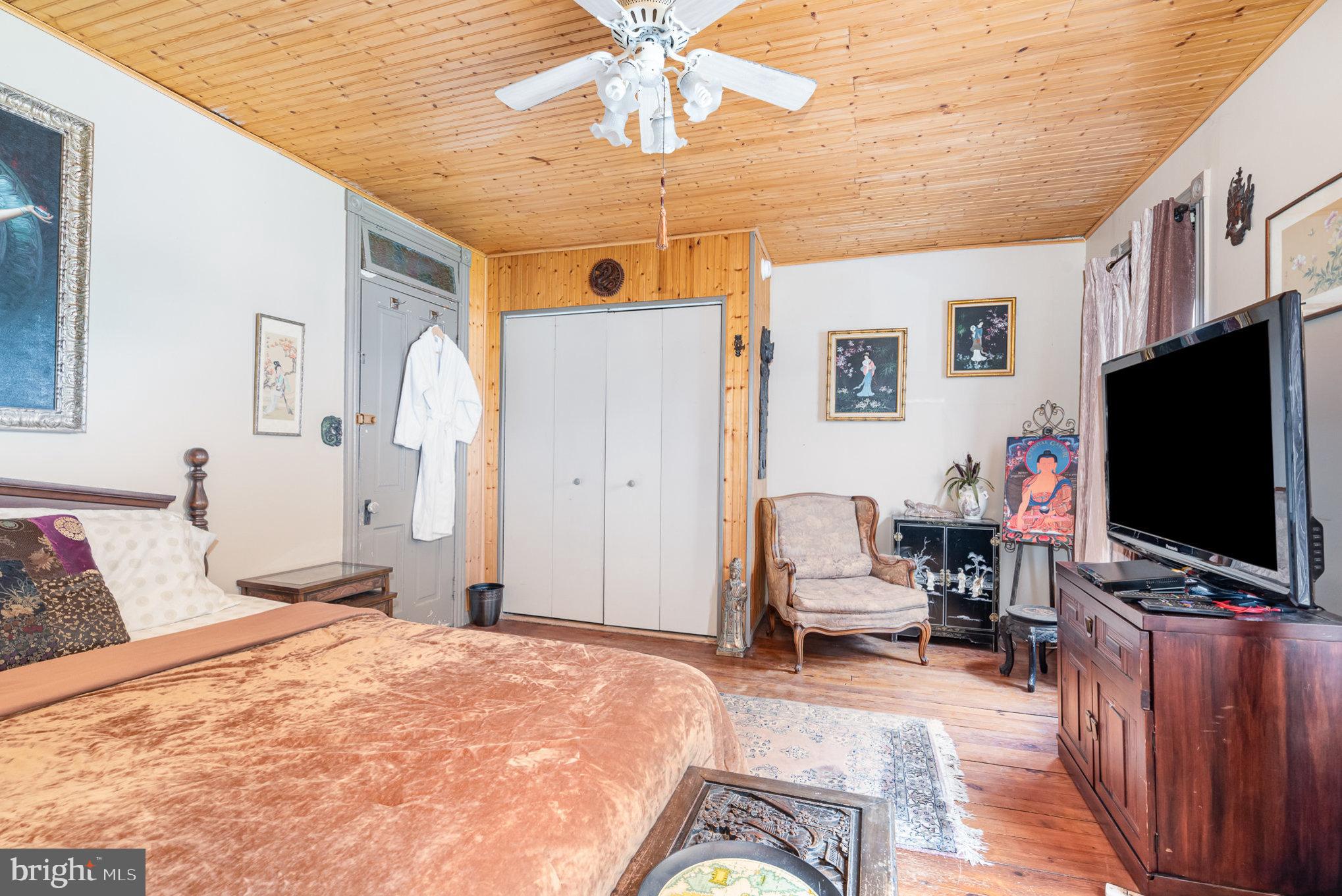 135 Lucknow Road Harrisburg, PA 17110 - Photo 15 of 27 a bedroom with a bed and a flat screen tv