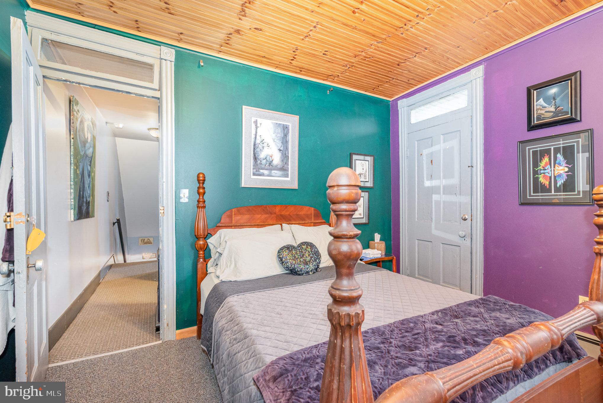 135 Lucknow Road Harrisburg, PA 17110 - Photo 17 of 27 a bedroom with a bed and a mirror