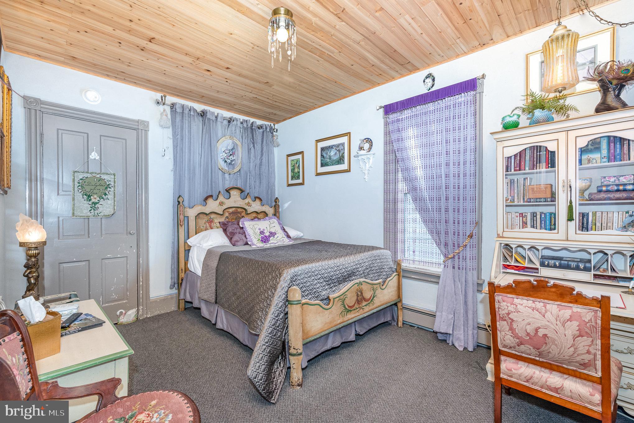 135 Lucknow Road Harrisburg, PA 17110 - Photo 19 of 27 a bedroom with a bed and wooden floor