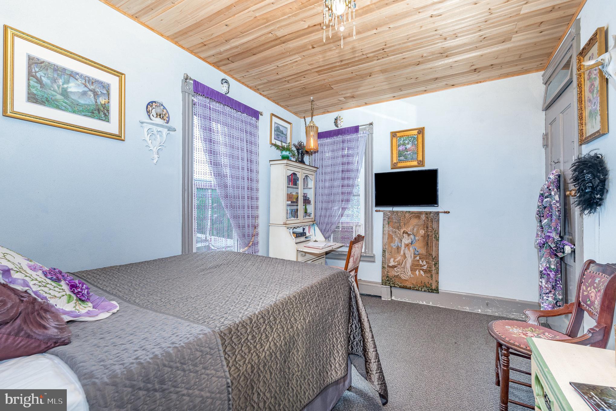 135 Lucknow Road Harrisburg, PA 17110 - Photo 20 of 27 a bedroom with furniture and a flat screen tv