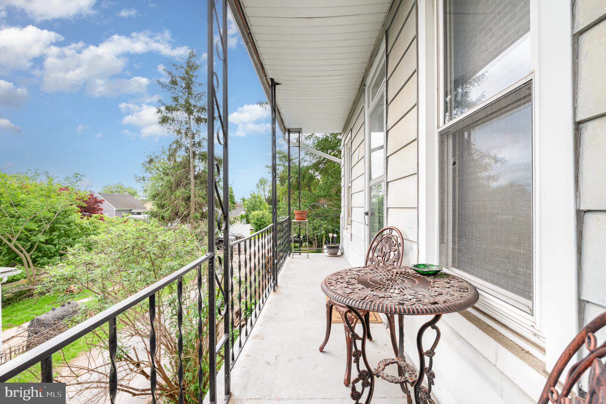 135 Lucknow Road Harrisburg, PA 17110 - Photo 23 of 27 a view of a balcony with table and chairs and potted plants