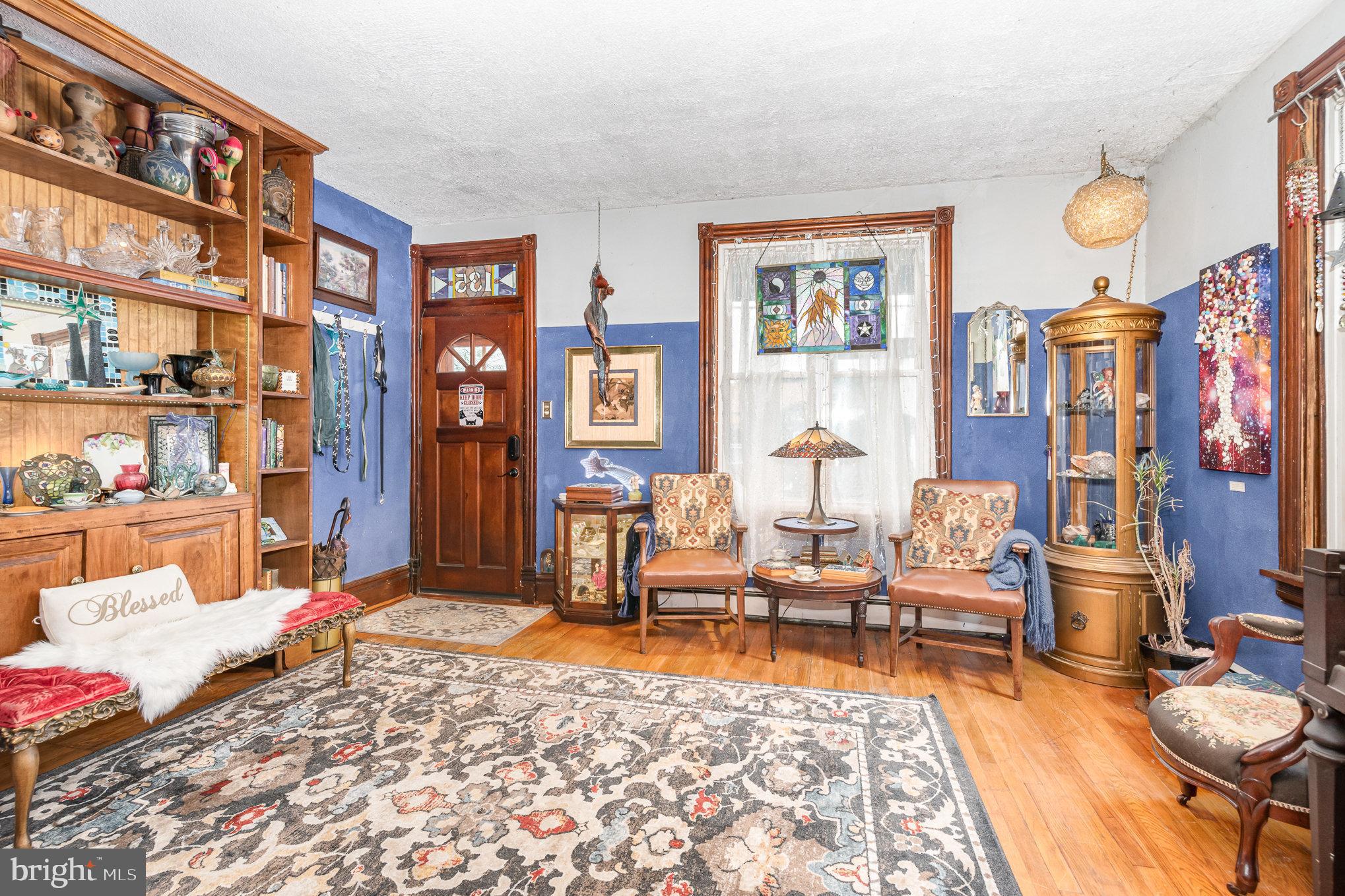 135 Lucknow Road Harrisburg, PA 17110 - Photo 5 of 27 a living room with furniture window and wooden floor