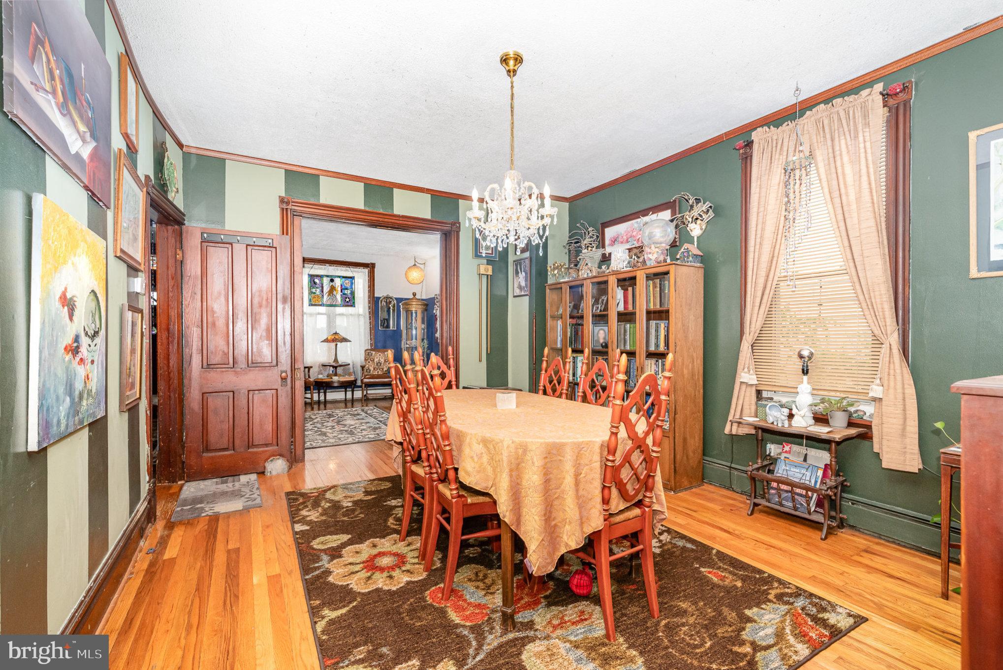 135 Lucknow Road Harrisburg, PA 17110 - Photo 7 of 27 a dining room with furniture a chandelier and wooden floor