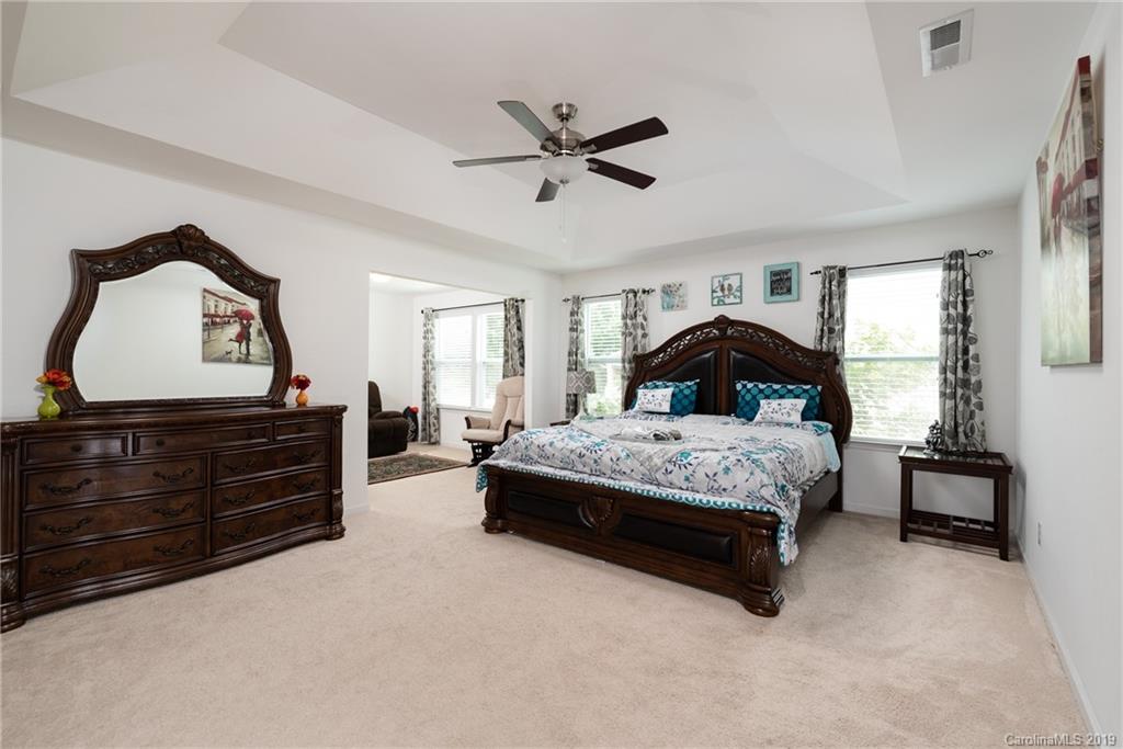 290 Fischer Road Fort Mill, SC 29715 - Photo 18 of 35 a bedroom with a bed and a dresser