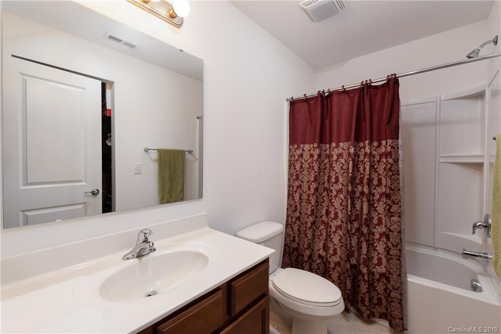 290 Fischer Road Fort Mill, SC 29715 - Photo 22 of 35 a bathroom with a sink a toilet and shower curtain