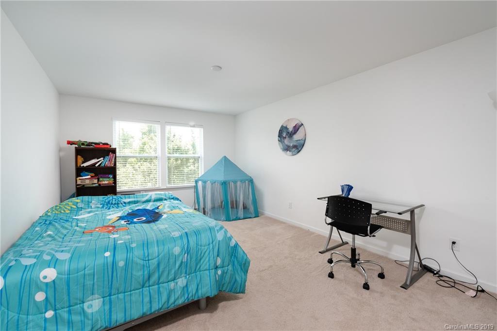 290 Fischer Road Fort Mill, SC 29715 - Photo 24 of 35 a bedroom with a bed and a window