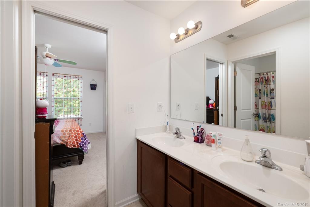 290 Fischer Road Fort Mill, SC 29715 - Photo 25 of 35 a en suite bathroom with a sink double vanity and a mirror