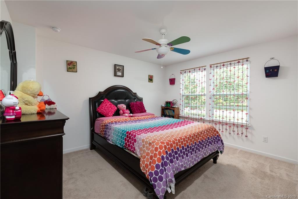 290 Fischer Road Fort Mill, SC 29715 - Photo 26 of 35 a bedroom with a bed dresser and a window